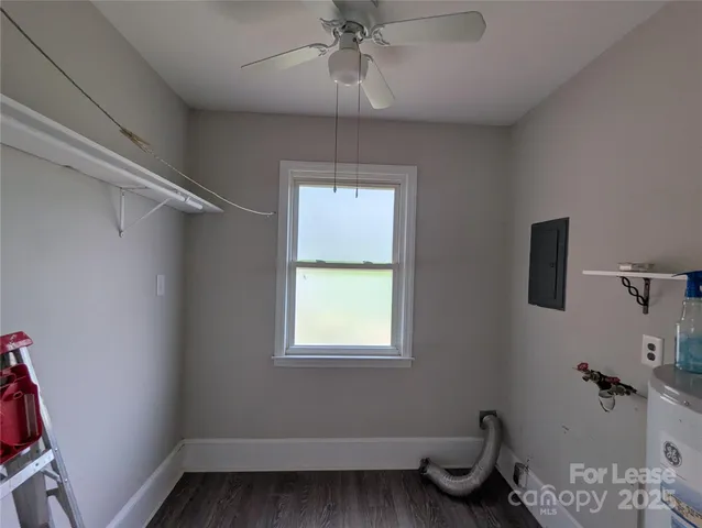 a bathroom with a window and a shower