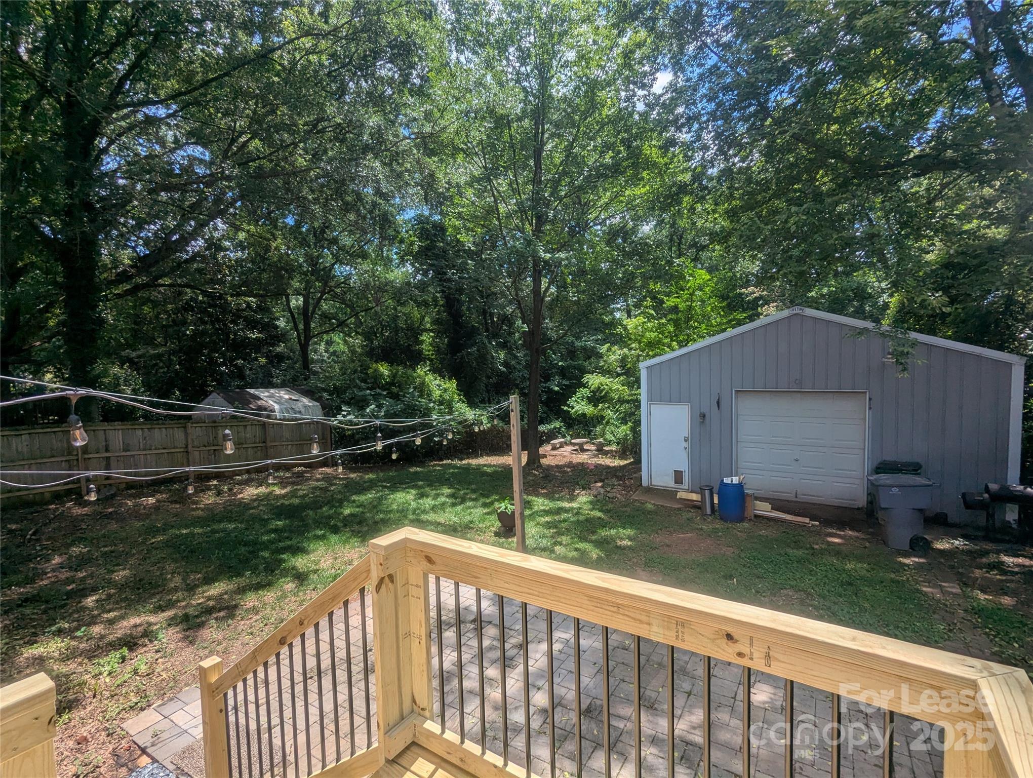 1614 Keeling Place Charlotte, NC 28210 - Photo 15 of 17 a view of a backyard with a small cabin