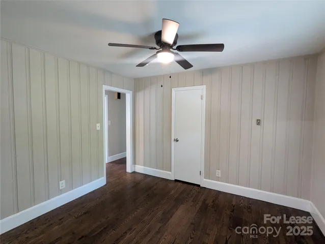 a view of an empty room and wooden floor