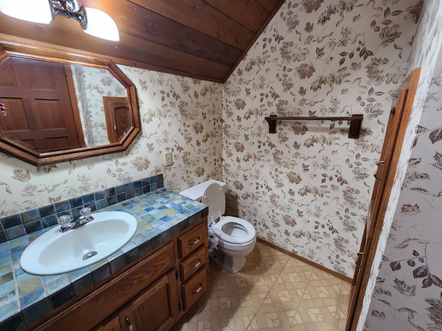 19500 Jesus Maria Road Mokelumne Hill, CA 95245 - Photo 34 of 92 a bathroom with a sink toilet and mirror