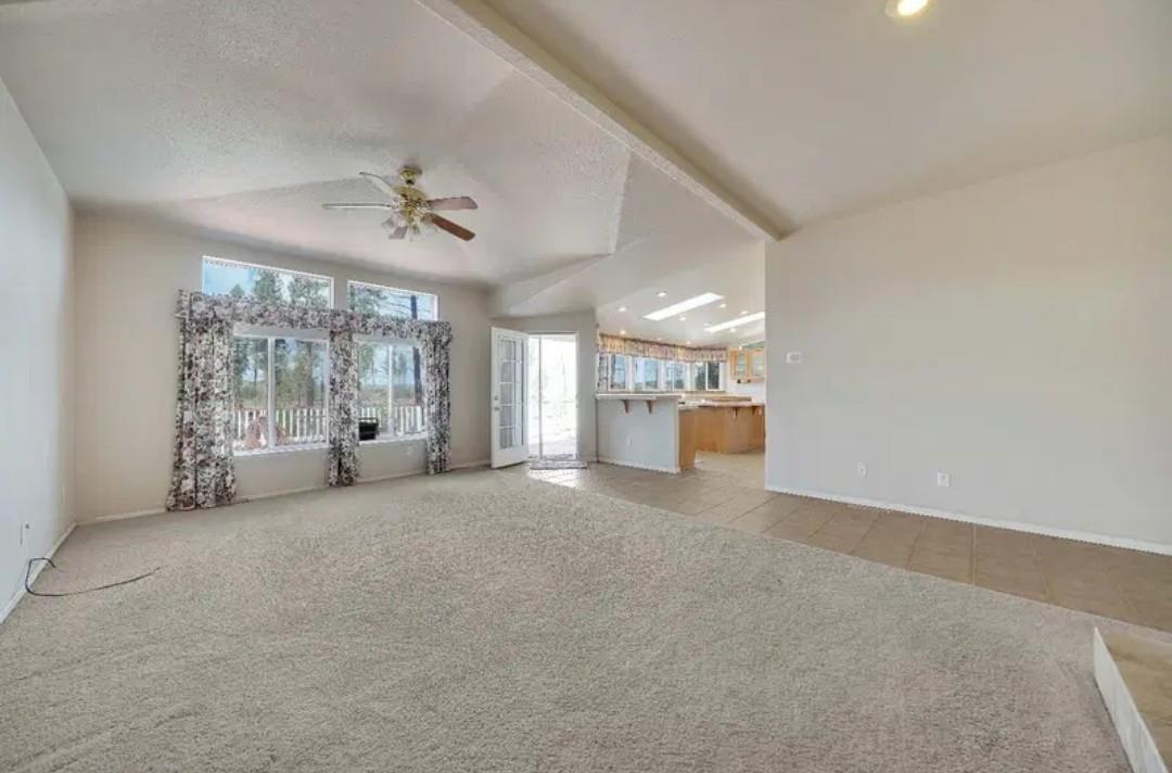 19500 Jesus Maria Road Mokelumne Hill, CA 95245 - Photo 70 of 92 a view of a big room with windows and chandelier fan