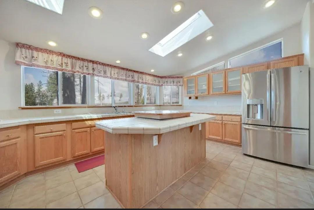 19500 Jesus Maria Road Mokelumne Hill, CA 95245 - Photo 72 of 92 a kitchen with granite countertop a sink and a refrigerator