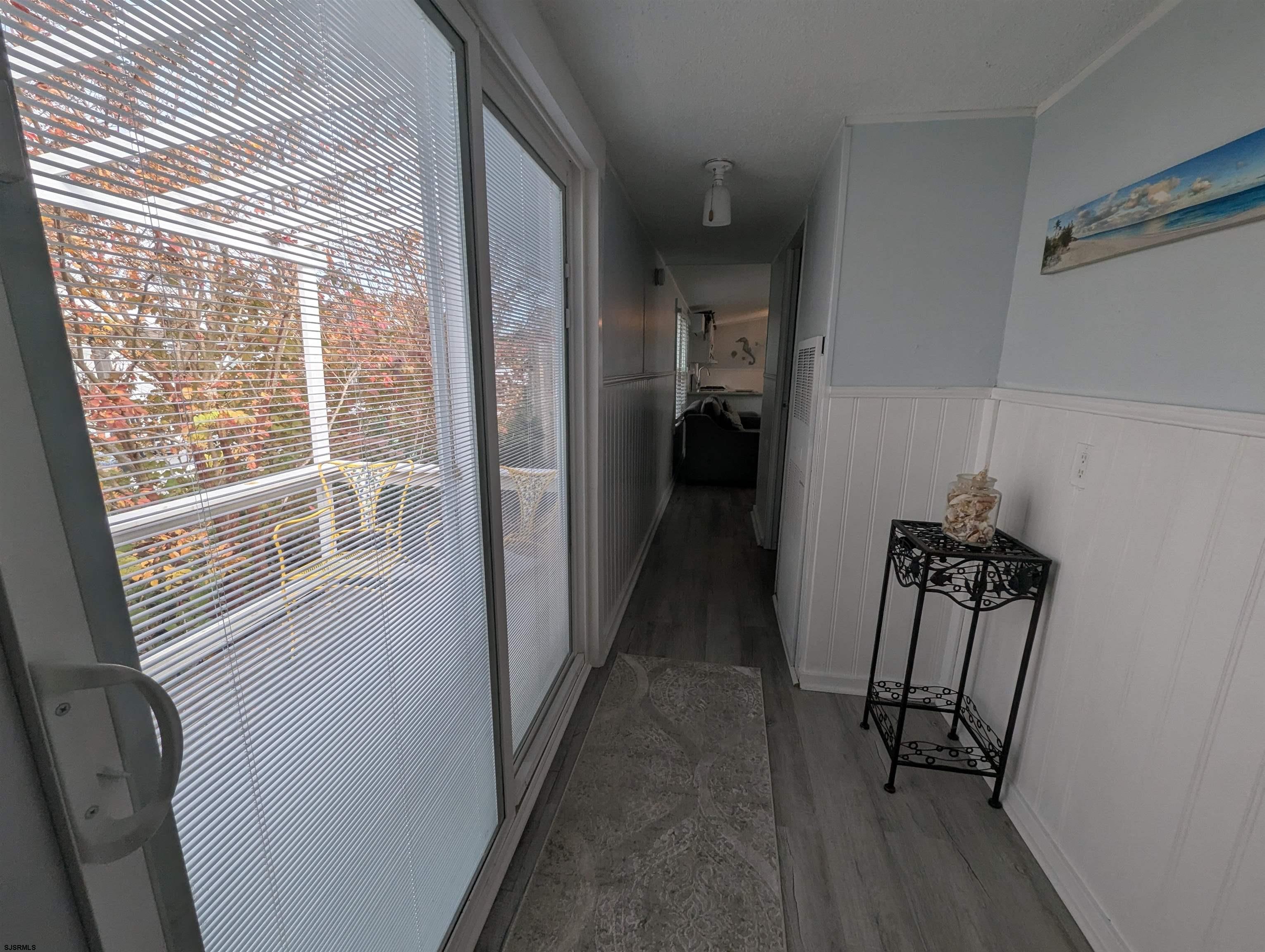 430 South Shore Road Marmora, NJ 08223 - Photo 17 of 21 a view of hallway with a window and wooden floor