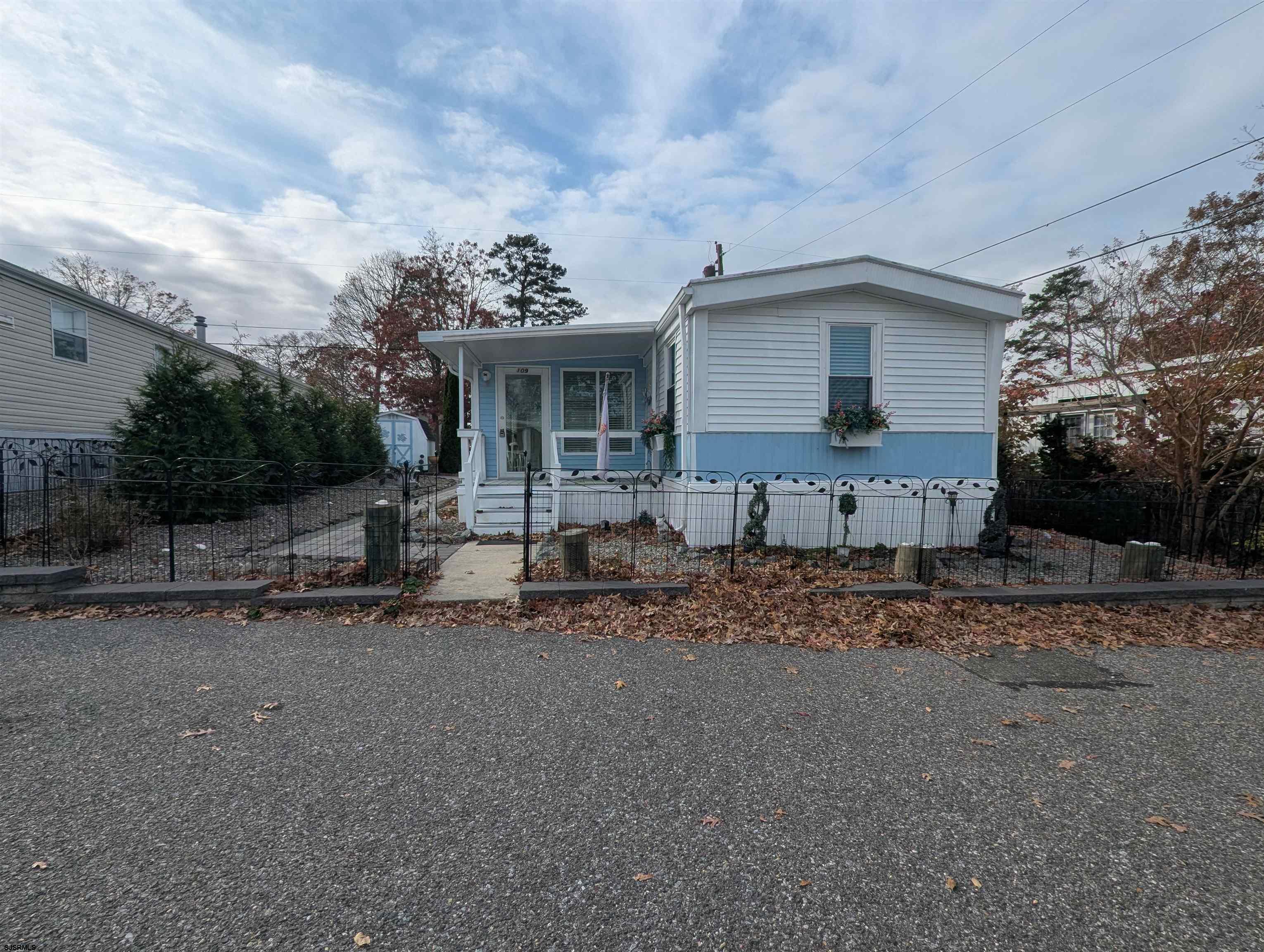 430 South Shore Road Marmora, NJ 08223 - Photo 2 of 21 a front view of a house with garden