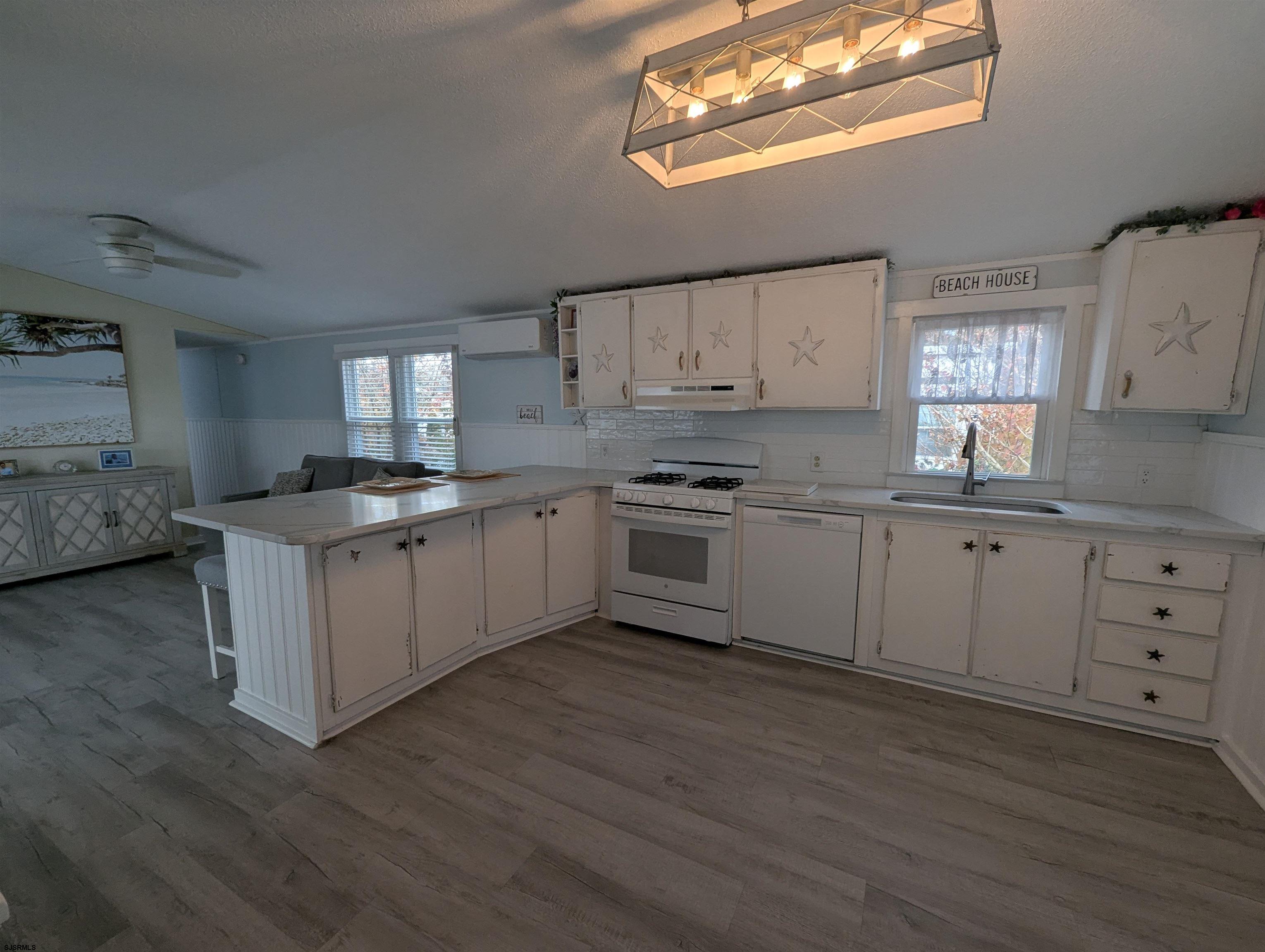 430 South Shore Road Marmora, NJ 08223 - Photo 7 of 21 a kitchen with cabinets a sink and appliances