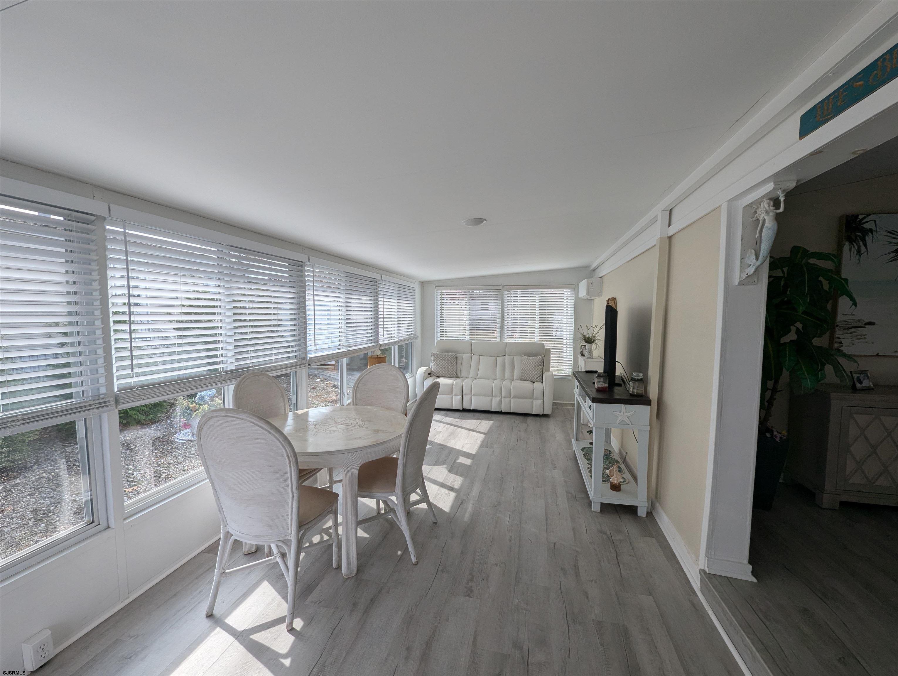 430 South Shore Road Marmora, NJ 08223 - Photo 9 of 21 a view of a dining room with furniture and wooden floor
