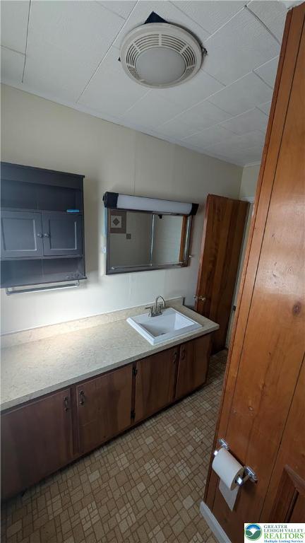 487 Club Road Bath, PA 18014 - Photo 17 of 22 a bathroom with a sink and a mirror