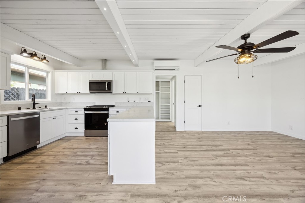 528 Creston Road Paso Robles, CA 93446 - Photo 9 of 46 a kitchen with a stove a sink and a refrigerator