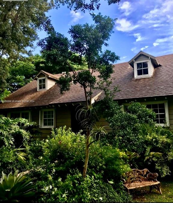 8420 Southwest 70th Street Miami, FL 33143 - Photo 1 of 20 a front view of a house with a yard
