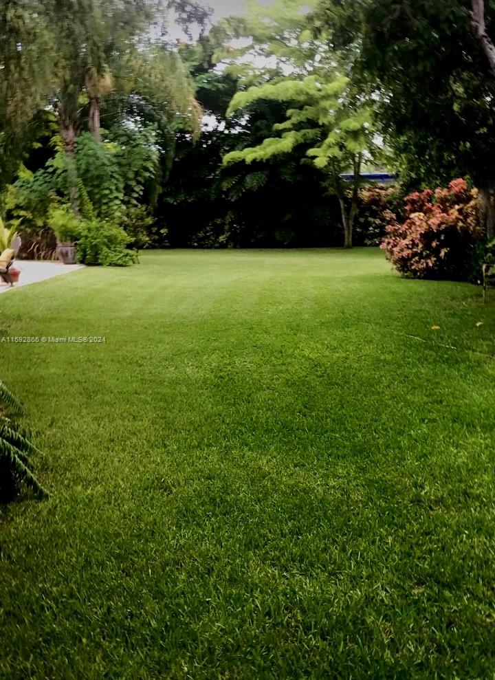 8420 Southwest 70th Street Miami, FL 33143 - Photo 18 of 20 a view of a field of grass and trees