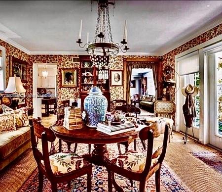 8420 Southwest 70th Street Miami, FL 33143 - Photo 2 of 20 a view of a dining room with furniture and chandelier