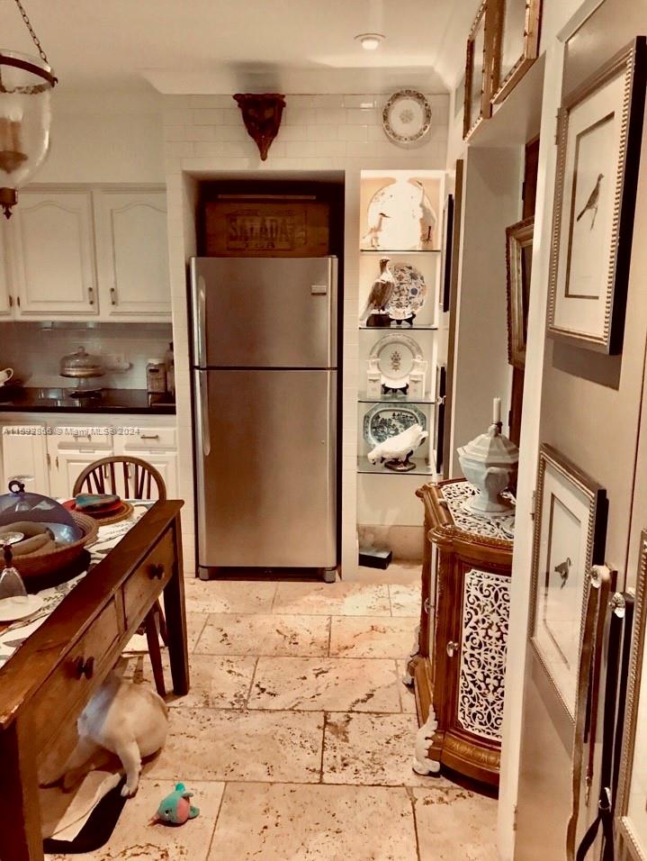 8420 Southwest 70th Street Miami, FL 33143 - Photo 5 of 20 a kitchen with stainless steel appliances granite countertop a refrigerator a stove and a sink