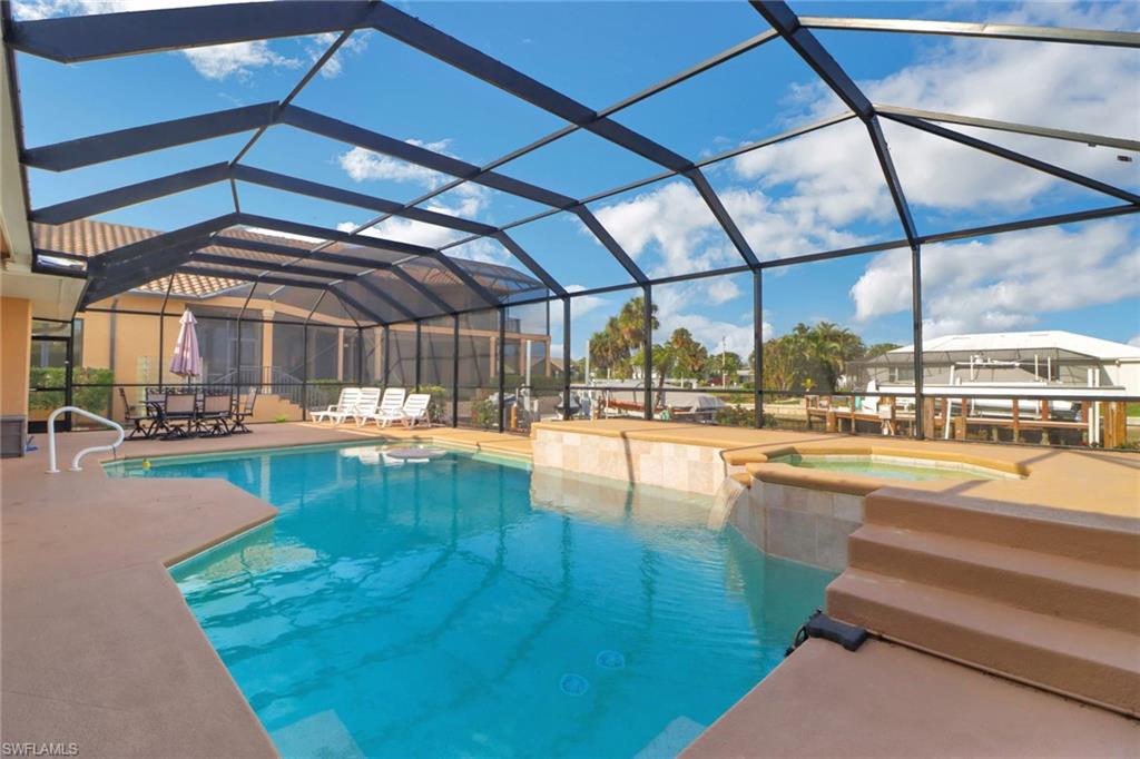 a view of swimming pool with outdoor seating