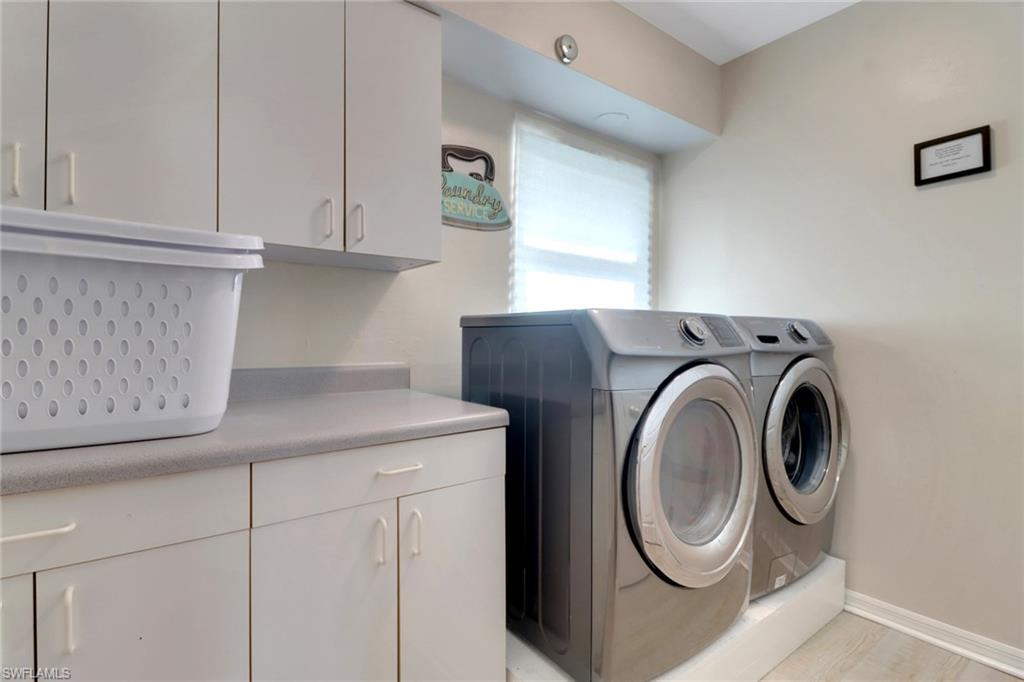 562 Goldcoast Court Marco Island, FL 34145 - Photo 18 of 28 a utility room with dryer and washer