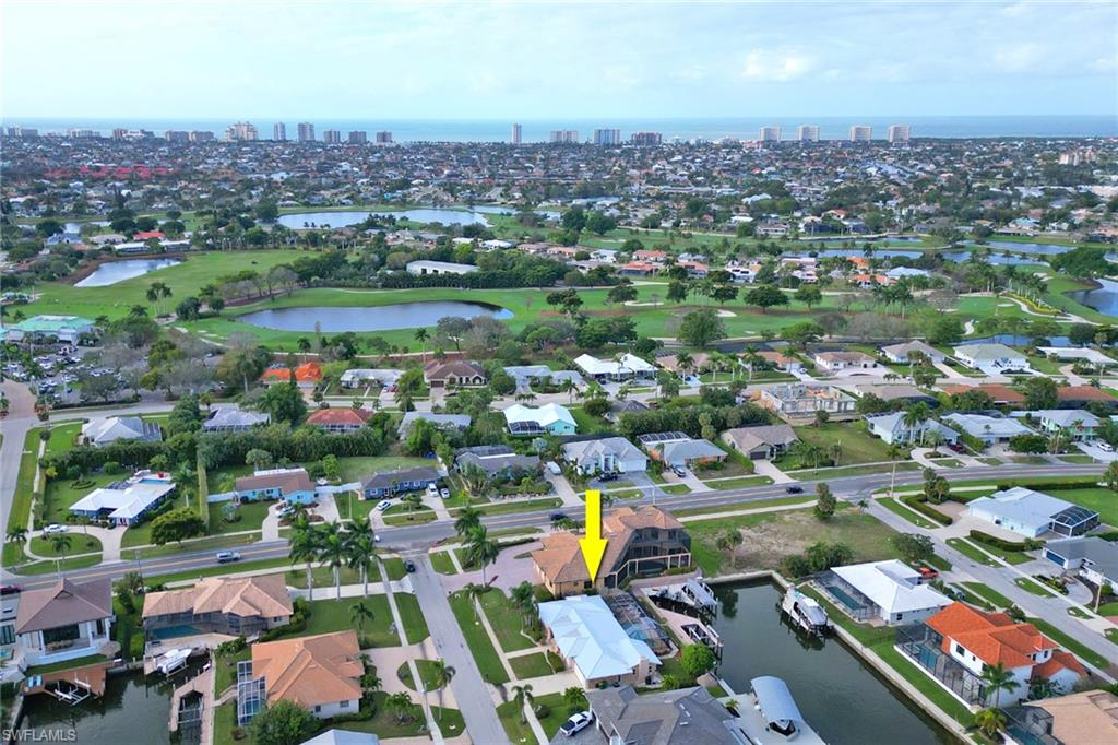 562 Goldcoast Court Marco Island, FL 34145 - Photo 26 of 28 an aerial view of a city with lots of residential buildings