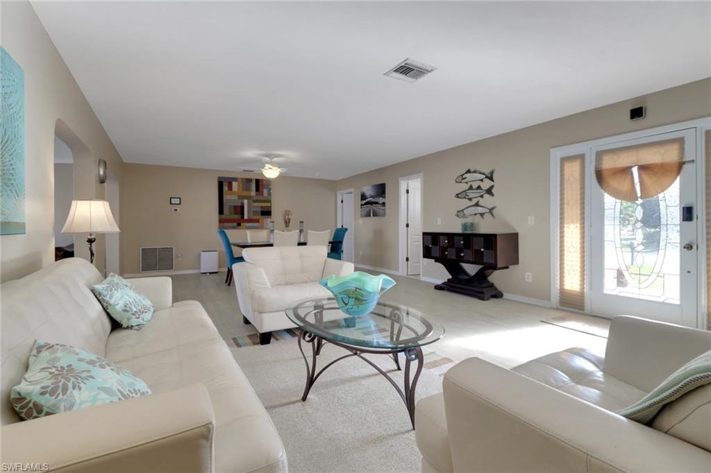 562 Goldcoast Court Marco Island, FL 34145 - Photo 8 of 28 a living room with furniture and a window