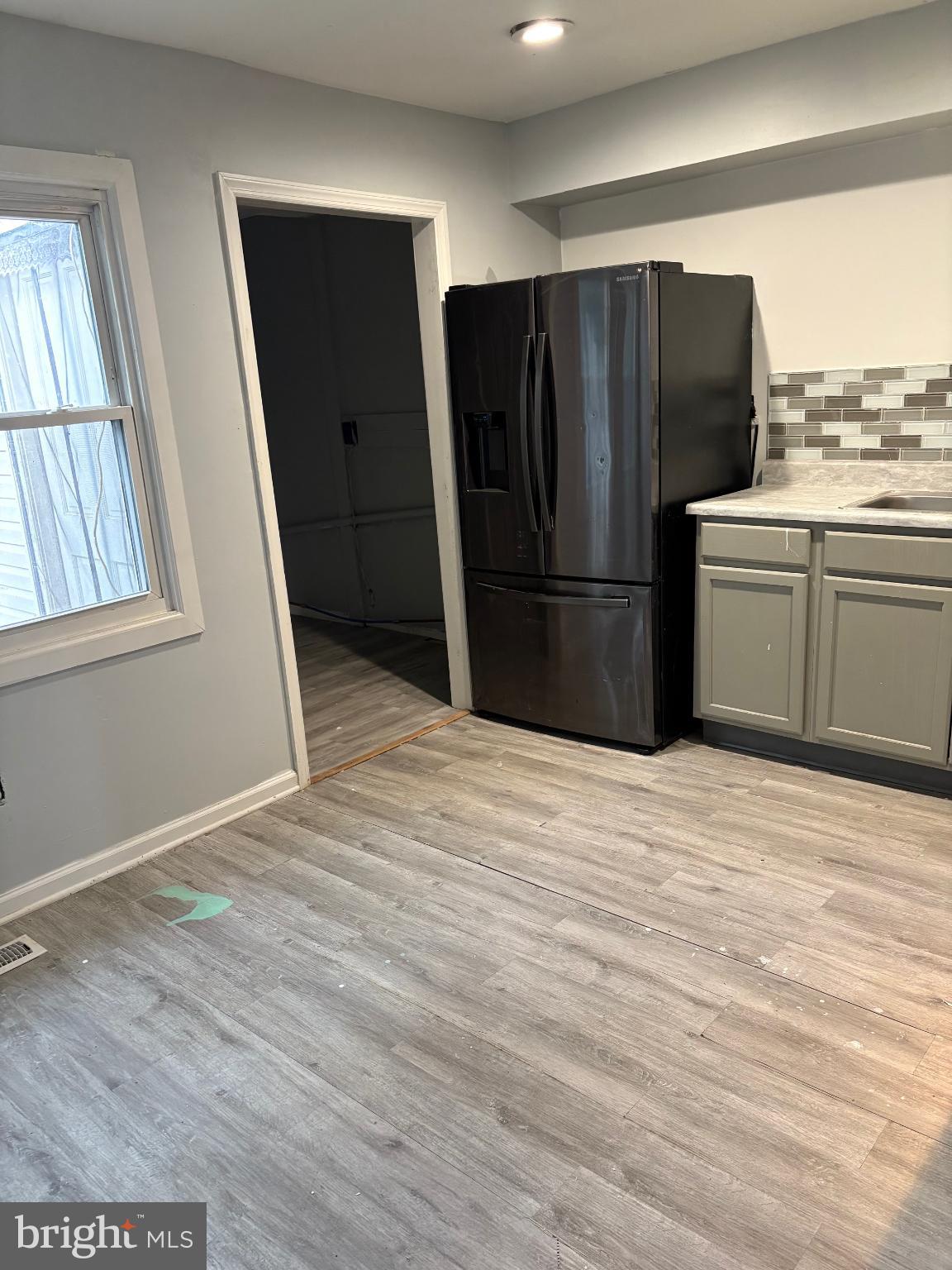 11 Ridgewood Place Willingboro, NJ 08046 - Photo 5 of 14 a kitchen with stainless steel appliances wooden floor sink and window