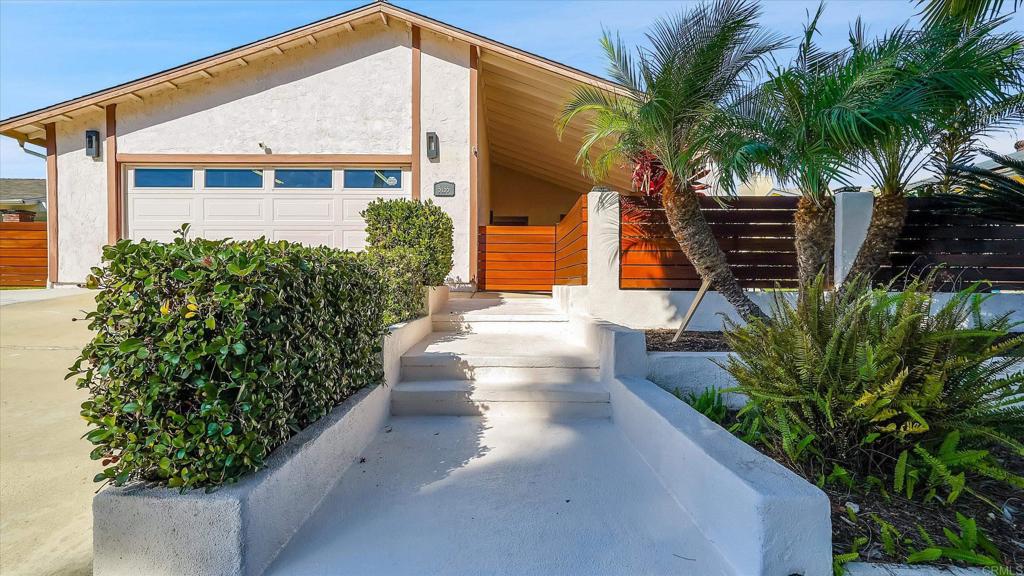 5155 Andrew Jackson Street Oceanside, CA 92057 - Photo 1 of 1 a front view of a house with garden