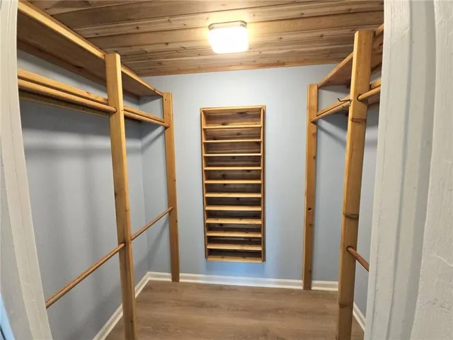 an empty room with wooden floor