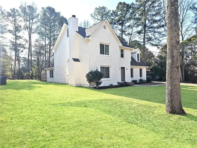 a front view of house with yard and seating area