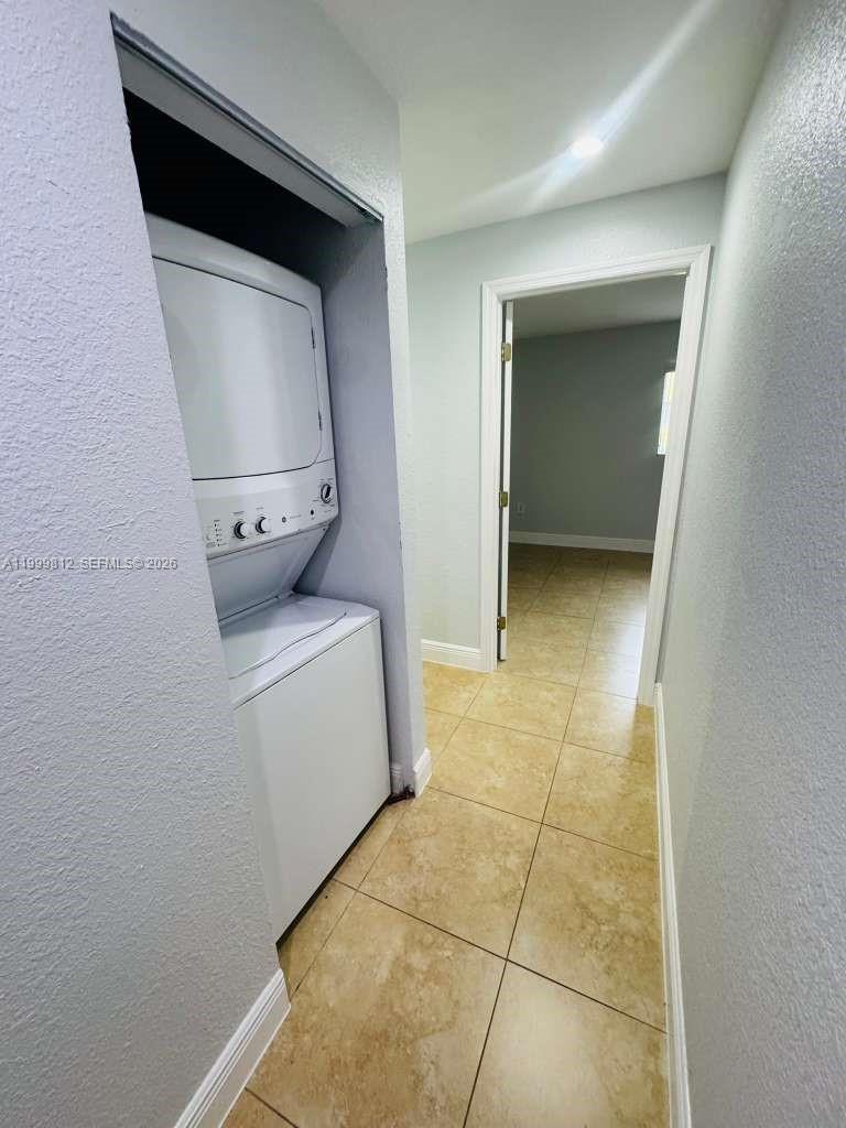 8270 Southwest 149th Court, Unit 10209 Miami, FL 33193 - Photo 15 of 32 a room with a washer and dryer