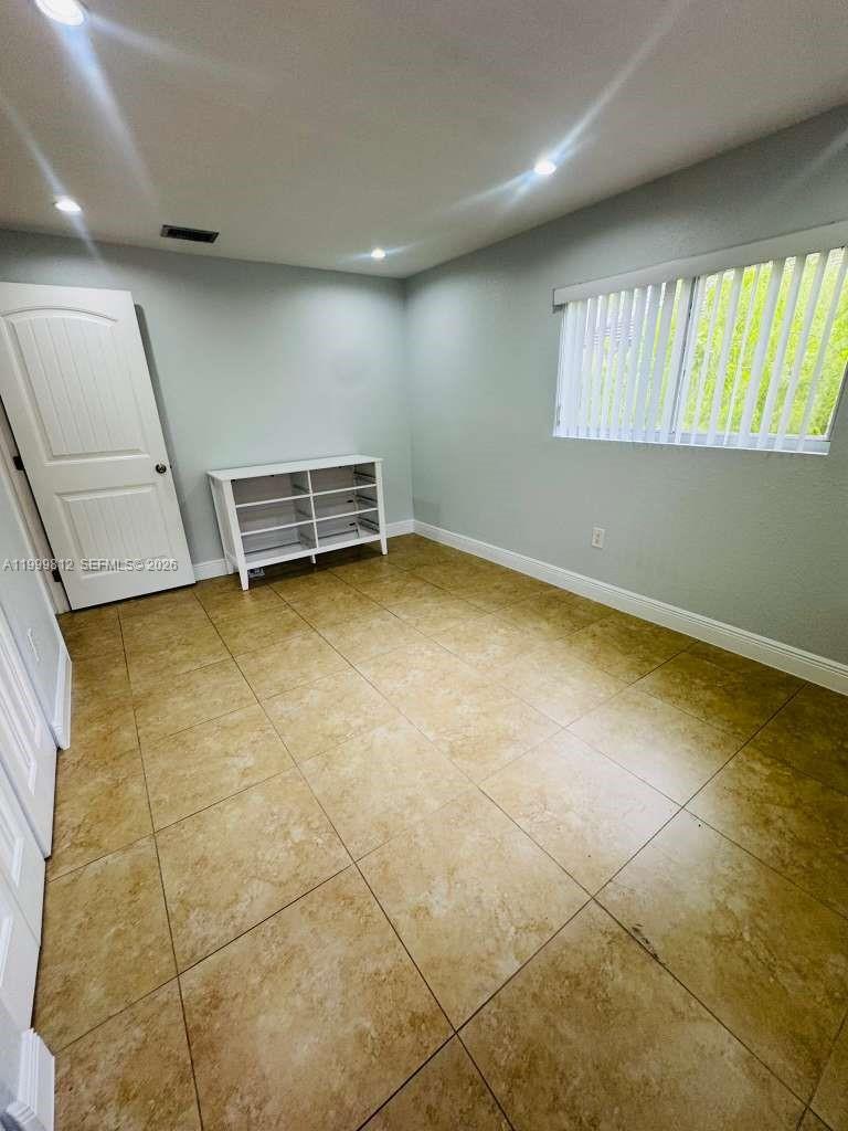 8270 Southwest 149th Court, Unit 10209 Miami, FL 33193 - Photo 18 of 32 a view of an empty room with a window