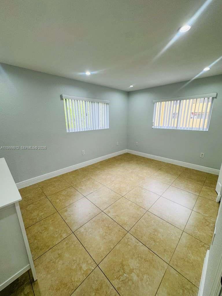 8270 Southwest 149th Court, Unit 10209 Miami, FL 33193 - Photo 20 of 32 a view of an empty room with a window
