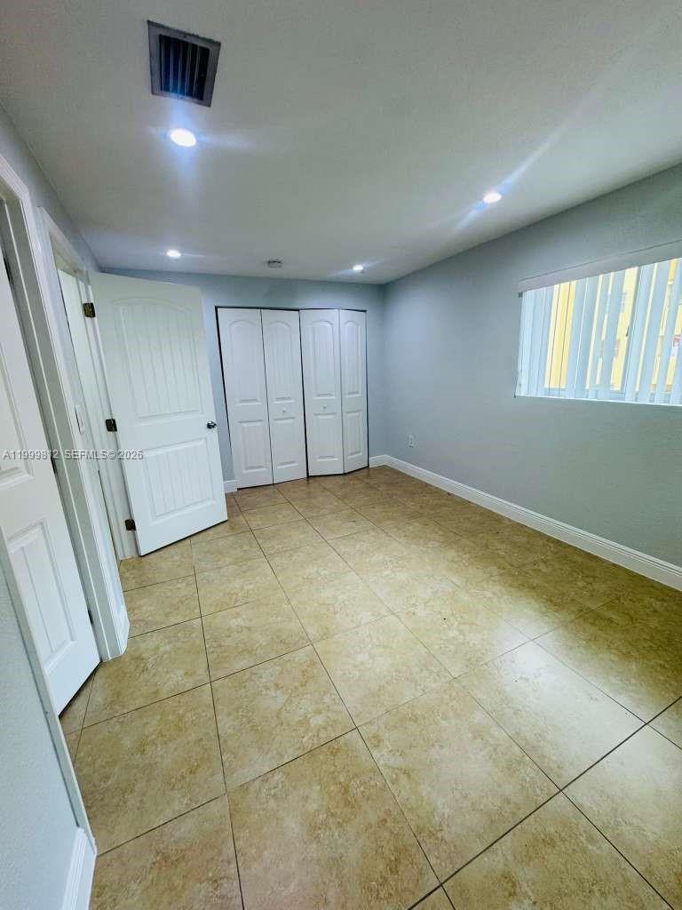 8270 Southwest 149th Court, Unit 10209 Miami, FL 33193 - Photo 21 of 32 a view of an empty room with a window