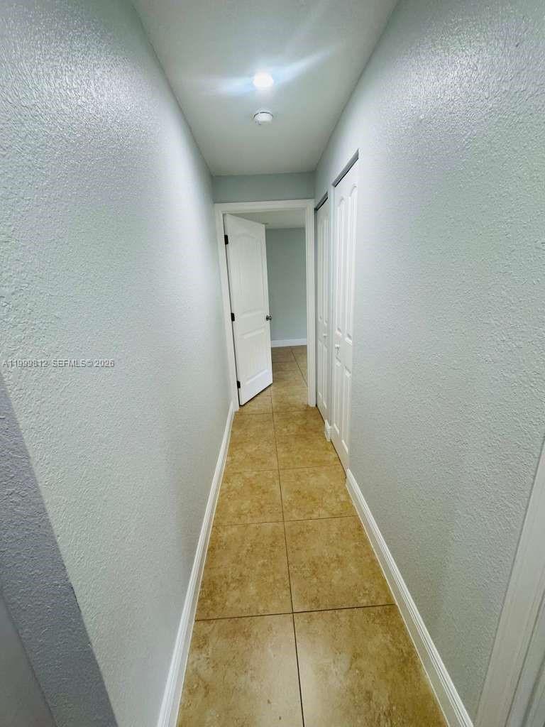 8270 Southwest 149th Court, Unit 10209 Miami, FL 33193 - Photo 22 of 32 a view of hallway with stairs
