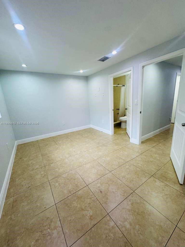 8270 Southwest 149th Court, Unit 10209 Miami, FL 33193 - Photo 25 of 32 an empty room with a bathroom