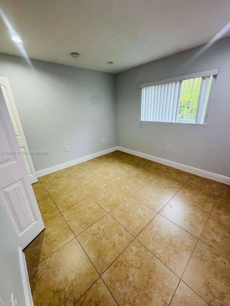 8270 Southwest 149th Court, Unit 10209 Miami, FL 33193 - Photo 30 of 32 a view of an empty room and a window