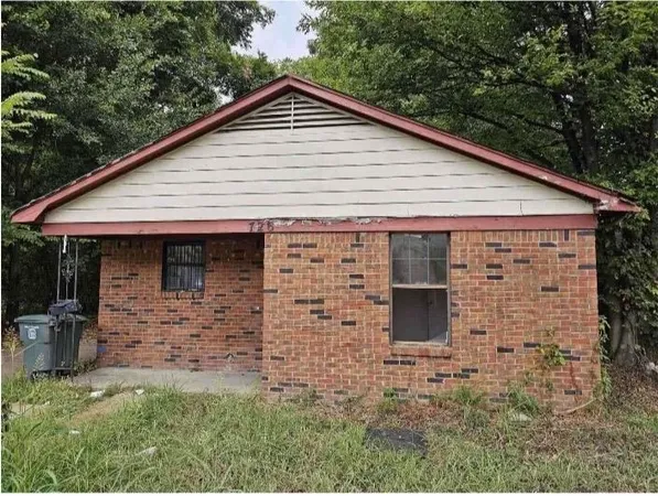 a front view of a house with garage