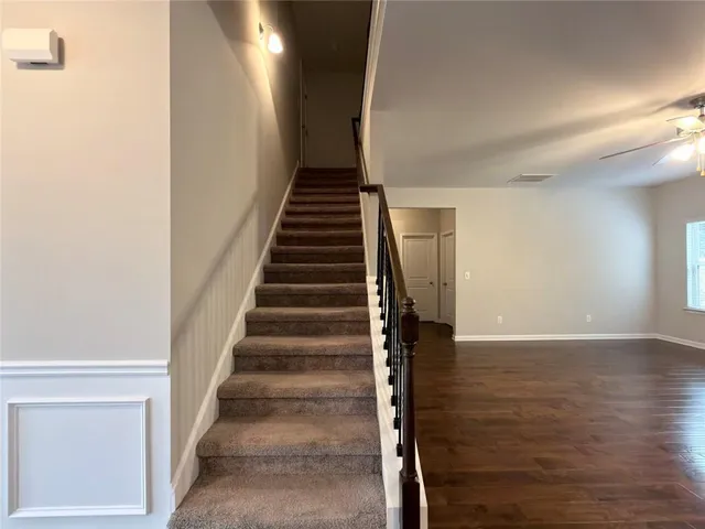 a view of a hallway with stairs