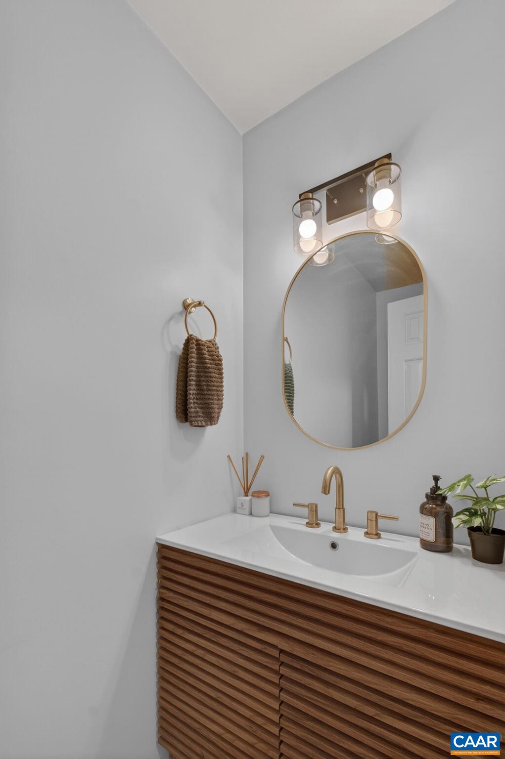 326 Westfield Road Charlottesville, VA 22901 - Photo 15 of 36 a bathroom with a sink and a mirror