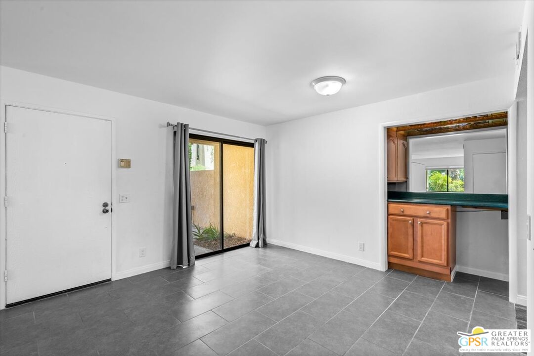 200 East Racquet Club Road, Unit 45 Palm Springs, CA 92262 - Photo 16 of 36 a view of an empty room with a window