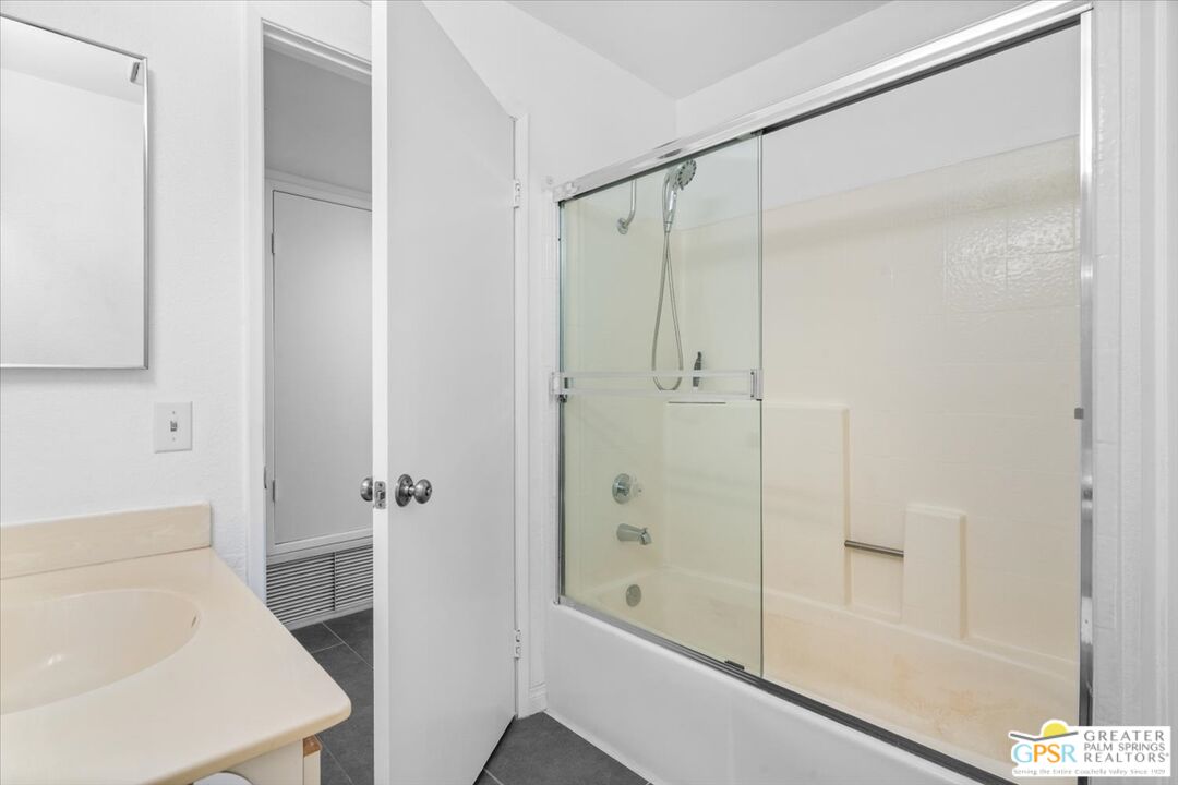 200 East Racquet Club Road, Unit 45 Palm Springs, CA 92262 - Photo 27 of 36 a bathroom with a shower and a tub
