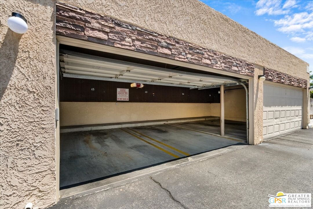 200 East Racquet Club Road, Unit 45 Palm Springs, CA 92262 - Photo 31 of 36 a view of a garage