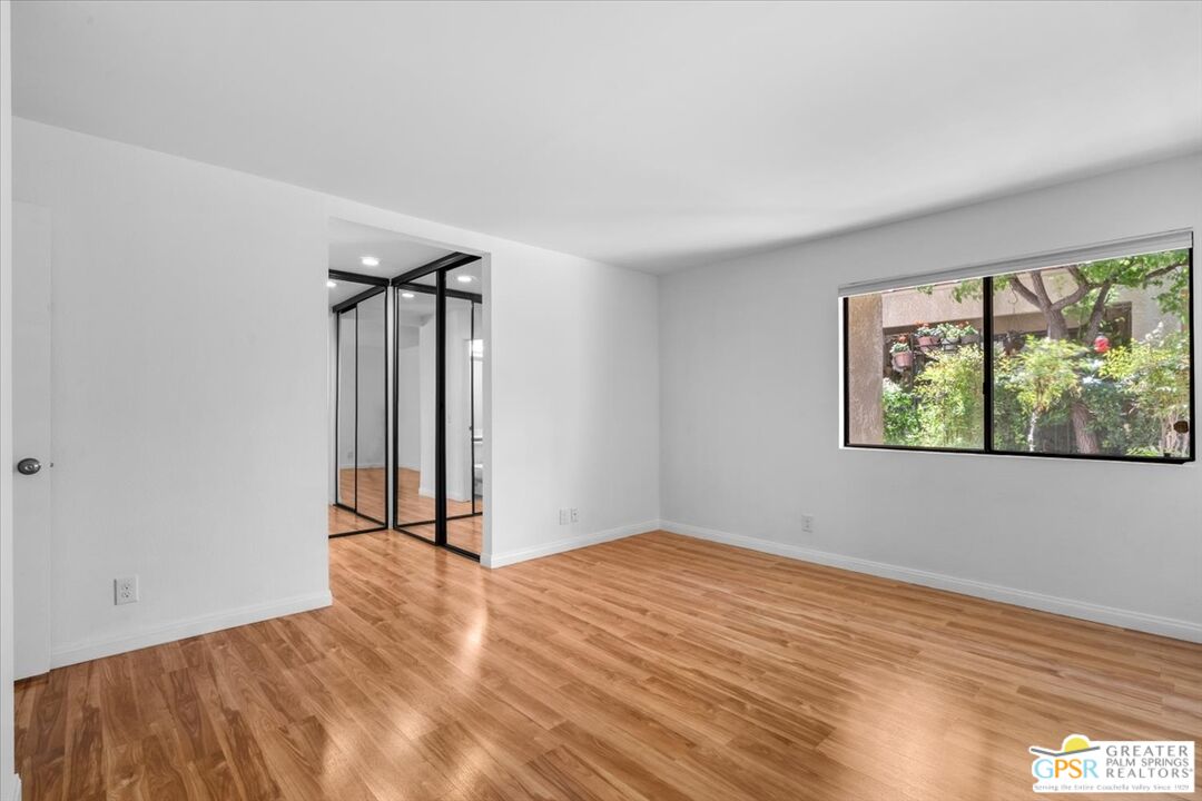 200 East Racquet Club Road, Unit 45 Palm Springs, CA 92262 - Photo 6 of 36 a view of an empty room with a window