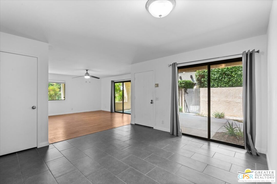 200 East Racquet Club Road, Unit 45 Palm Springs, CA 92262 - Photo 8 of 36 a view of a room with window and wooden floor