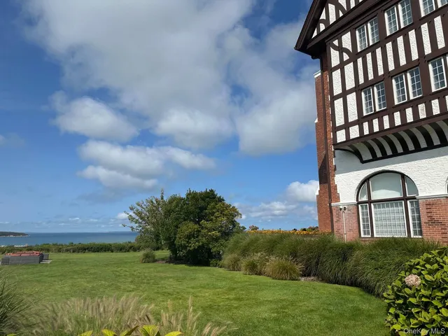 a view of hall way with furniture