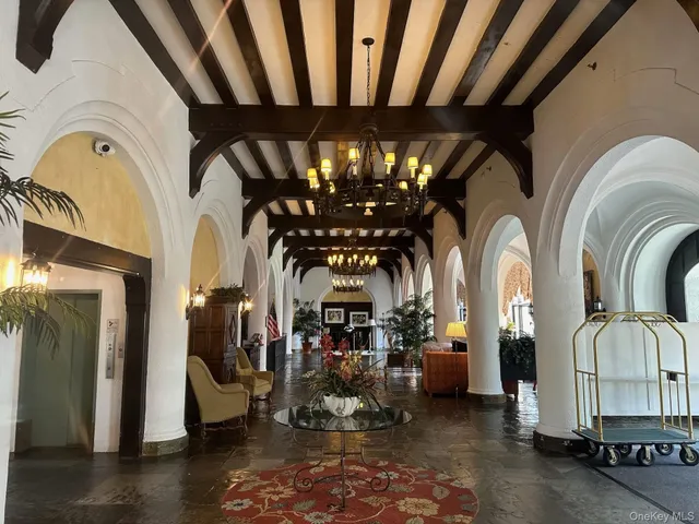 a view of a chairs and tables in a patio