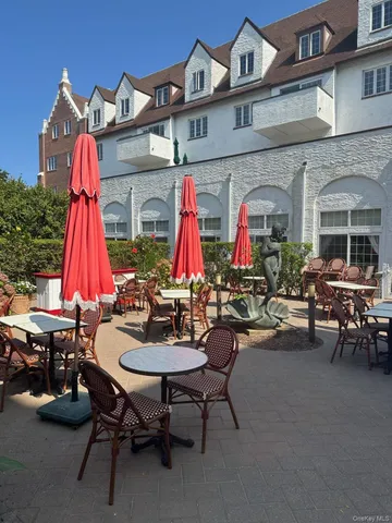 a view of backyard with a table and chairs