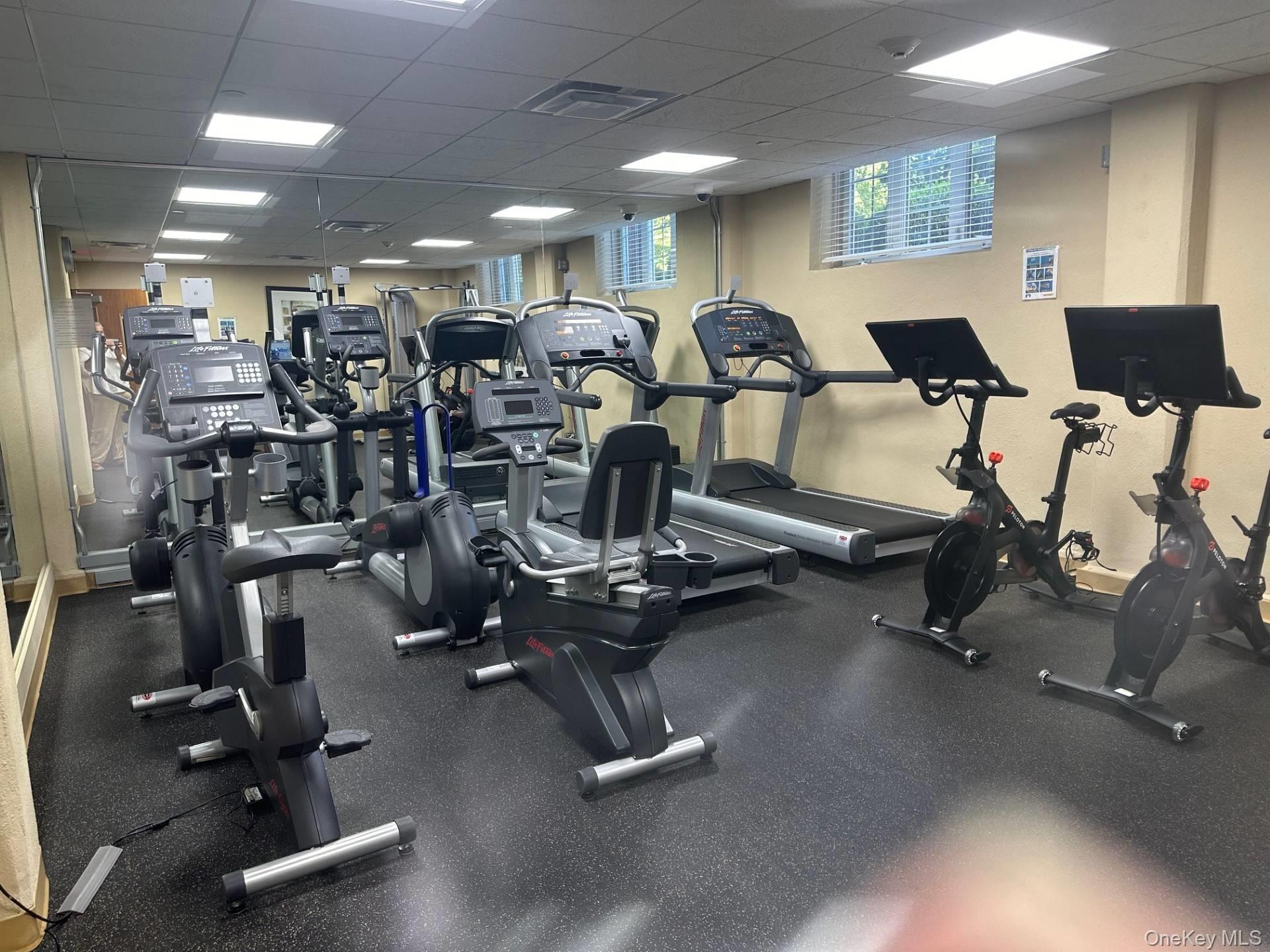 236 Edgemere Street, Unit 423 Montauk, NY 11954 - Photo 23 of 24 a view of a room with gym equipment