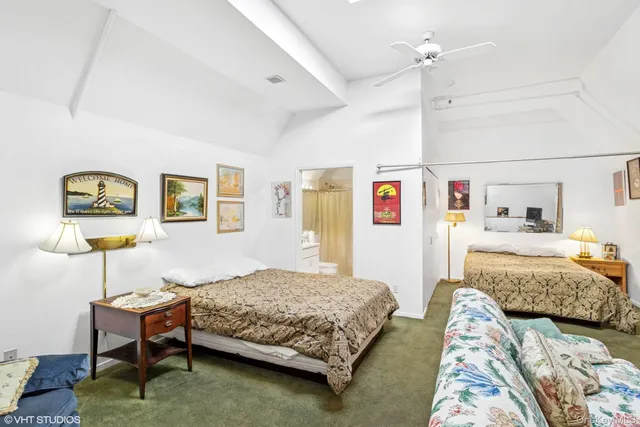 a bedroom with a bed and a couch