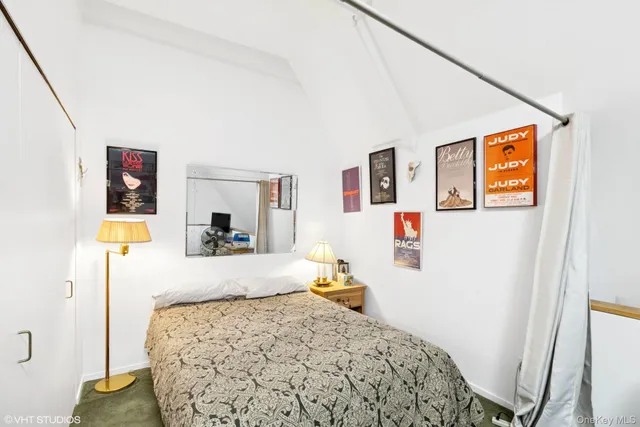 a bedroom with a bed and a couch