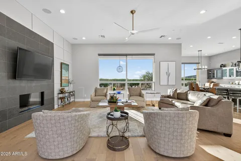 a large kitchen with stainless steel appliances kitchen island granite countertop a large center island a stove a sink a dining table and chairs