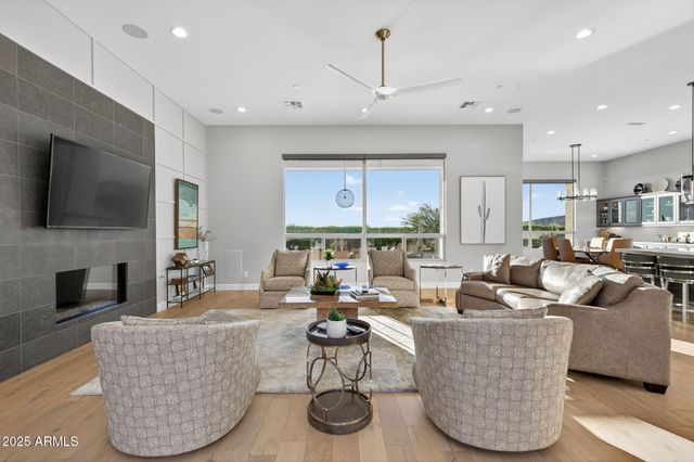 a large kitchen with stainless steel appliances kitchen island granite countertop a large center island a stove a sink a dining table and chairs