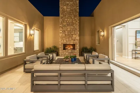 a roof deck with dining table and chairs