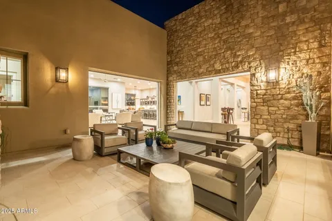 a open kitchen with stainless steel appliances granite countertop a sink a stove and a refrigerator