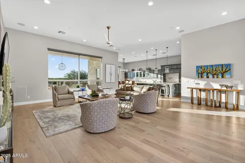 a living room with furniture a window and gym equipment